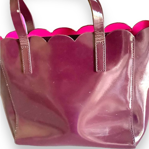 Kate Spade beautiful plum in a vinyl material . In pre owned condition. - Picture 2 of 7